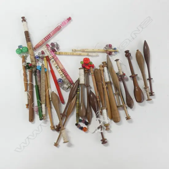 Assorted lace making bobbins.